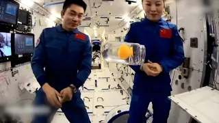 Taikonauts teach class on water buoyancy in absence of gravity