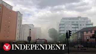 Deptford: 100 firefighters battling blaze on roof of London flats