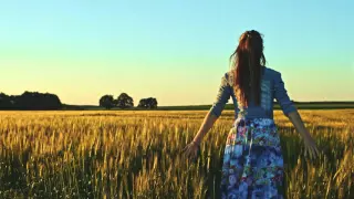 beautiful girl running on sunlit wheat field slow motion 120 fps freedom concept happy woman having