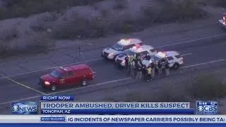 Passing driver kills man attacking Arizona trooper on road