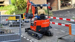 Construction of an island and pedestrian crossing for the school, RC excavator Kubota, CAT loader