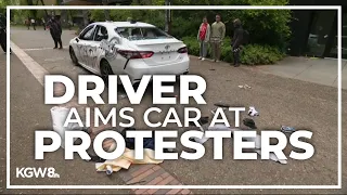 Driver rolls toward protesters on Portland State University camps, launching pepper spray