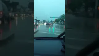 Drivers try to pass through flooded roads in