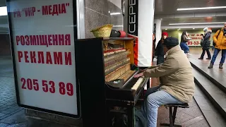 Ukraine, Kyiv metro underground under maidan Square man playing robert miles children: