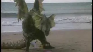 Eustace the dragon plays on the beach
