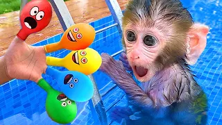 Bebé Mono Bon Bon Nadando con un Globo Arcoíris y un Lindo Cachorro - MONO BONBON ESP