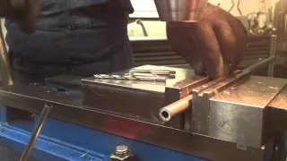 Drilling and tapping a hole in round stock
