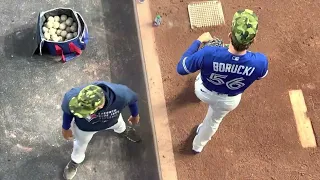 Toronto Blue Jays pitcher Ryan Borucki places the PitchCom device in his cap May 20 2022 4K video