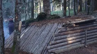 Primitive technology: Three underground shelters.fireplace made with stone and clay inside.moss