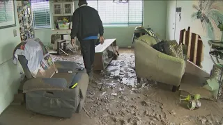 San Diego Storm Clean Up | Residents remove layers of mud from streets and houses