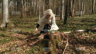 Female Shaman executing magical ritual in forest