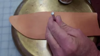 Large knife leather sheath construction.