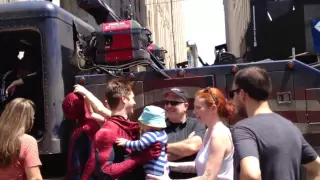 The Amazing Spider-Man, Andrew Garfield, greets a tiny fan while filming in NYC