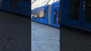 Blue Tram Driving Through the Centre of Krakow Old Town in Poland