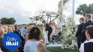 Paralyzed football player walks down the aisle at his wedding - Daily Mail