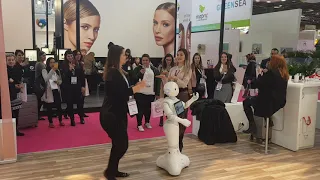 Pepper Robot dancing with girl at innovation event !