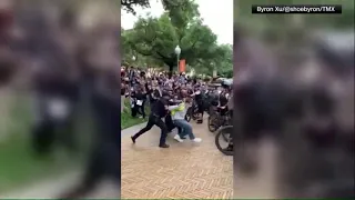 Pro-Palestine protesters at UT Austin confront officers on horseback