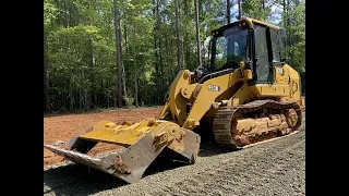 Grading a house pad with a CAT 953K