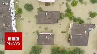 Drone footage shows China floods devastation - BBC News