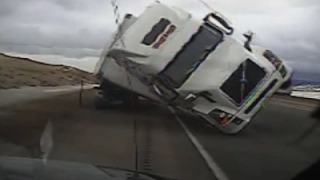 Raw: Big Rig Blows Over, Crushes Patrol Car