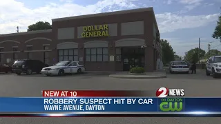 Robbery suspect hit by car