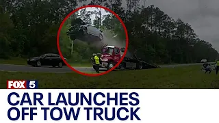 Car launches off back of tow truck | FOX 5 News