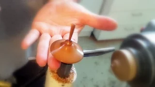 Spin Top on top of finger- Woodturning by Eli Avisera