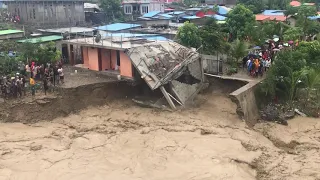 Building Collapses Into Raging Floodwater in Dili, East Timor