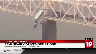 Caught on camera: semi truck nearly drives off bridge