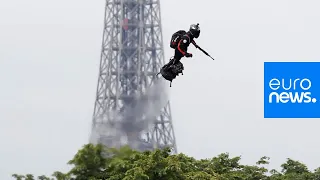 Jet-powered flyboard steals show at Bastille Day military parade