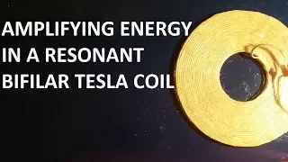 Amplifying energy in a bifilar coil, by simultaneously using 2 methods of inducing resonance