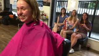 German Backpackers Get Haircuts