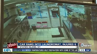 SUV slamming into laundromat caught on camera