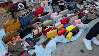 NYC Views of Street vendors selling imitation designers 🎒 bags around Canal Street in Chinatown.