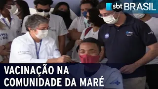 Moradores da comunidade da Maré recebem vacina contra covid | SBT Brasil (29/07/21)