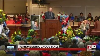 Superhero funeral honors 6-year-old fatally shot at school