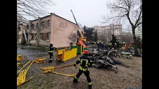 Ukrainian Emergency Workers Cover Bodies At Helicopter Crash Site