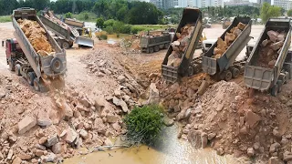 Perfective Operation Bulldozers Pushing Rock And Stone Filling Massive Project