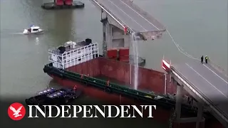 Two dead after container ship crashes into bridge in China