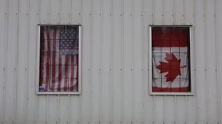 For These Border Towns, The Only Wall Here is a Row of Potted Plants