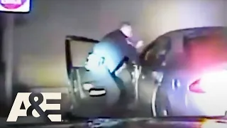 Court Cam: Woman Nearly Crushes Officer Into Car in Attempt to Drive Off | A&E