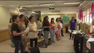 Hong Kong migrant mothers sing for their distant children