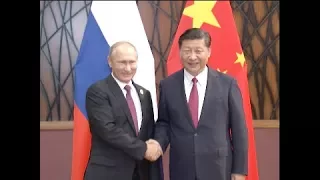 Xi, Putin Pledge to Enhance Regional, International Cooperation