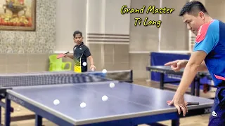 Ti Long guides for 9 year old Dutch talent to serve the Forehand Pendulum