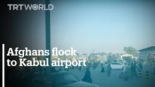Afghans flock to airport in attempt to flee the country