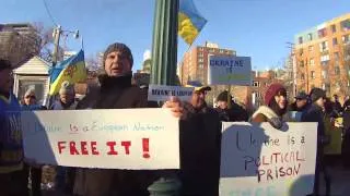 Demonstrators (and dog) supporting Ukraine in EU and singing outside Ukrainian Embassy in Ottawa.