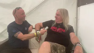 Biff Byford from Saxon chats to Neil Jones from TotalRock at Bloodstock 2021