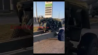 Several abandoned Ukrainian howitzers and KrAZ trucks in the Kherson oblast