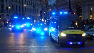 6 Metropolitan Police vehicles responding through Trafalgar Square