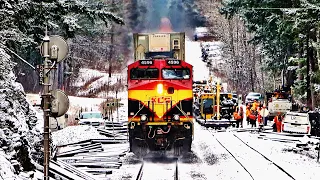 BUSY MORNING OF FREIGHT TRAINS PASSING RAIL GANG WAITING FOR WORK CLEARANCE